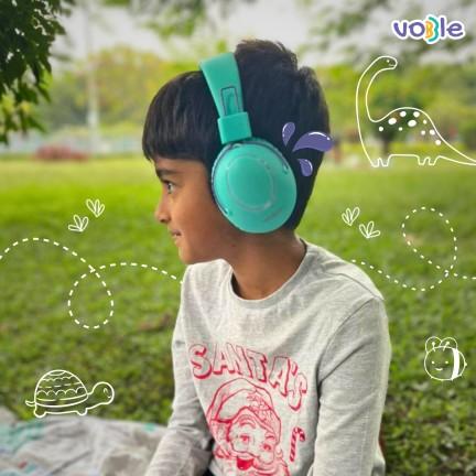 Kid Engaged with Our Headphones While Drawing